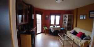 a living room with a couch and a table at Casa Sierra in Candelario