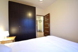 A bed or beds in a room at Apartament Bema 38