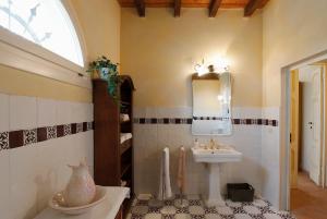 a bathroom with a sink and a mirror at Belvedere in Zola Predosa +21 photos