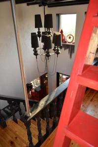 a red staircase with a red ladder in a room at Чудо-Дом для Чудо-Людей in Plakhtyanka