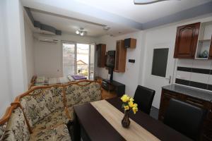 a living room with a couch and a table at Nova Apartments in Ohrid