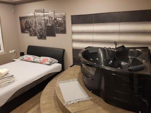 Ένα ή περισσότερα κρεβάτια σε δωμάτιο στο Ceca Apartman