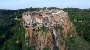 a castle perched on top of a mountain at Suite d'Artista Calcata in Calcata