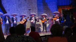 a group of people playing instruments on a stage at Suites at Mayan Palace Vidanta Resort Riviera Maya in Playa del Carmen