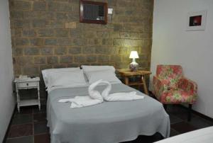 Postel nebo postele na pokoji v ubytování Quilombo Hotel Fazenda + 37 fotografií