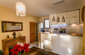a kitchen with a table and a counter top at Nina in Herceg-Novi