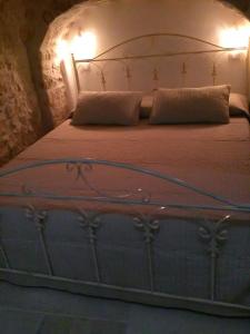 Postel nebo postele na pokoji v ubytování Trulli Resort Grassi