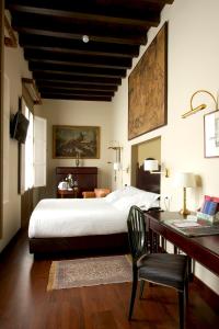 Giường trong phòng chung tại Las Casas de El Arenal