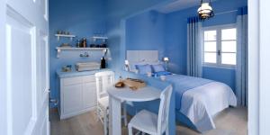 a kitchen with a blue and white checkered floor at Senses Boutique Hotel in Imerovigli