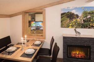 Televízia a/alebo spoločenská miestnosť v ubytovaní Bergspitz Luxury Appartement