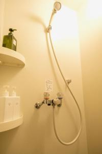 Baðherbergi á GuestHouse Hostel MangeTak ゲストハウス マングタック広島