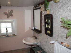 a bathroom with a sink and a mirror at Quaint Holiday Home in Schwaan near the Lake in Schwaan