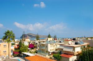 a view of a city with buildings and the ocean at Raisakis Apartments in Agia Marina Nea Kydonias