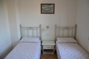 A bed or beds in a room at Residence Costa Del Turchese