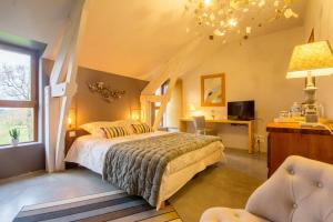 Postel nebo postele na pokoji v ubytování Le Clos du Gusquel + 37 fotografií