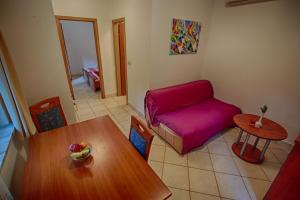 Posezení v ubytování Rosemary Apartments & Rooms + 33 fotografií
