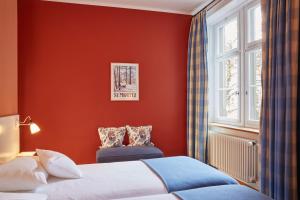 Postel nebo postele na pokoji v ubytování hotel brasserie au violon