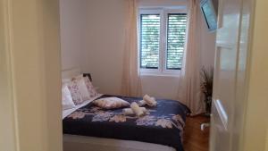 Postel nebo postele na pokoji v ubytování APARTMENT "Patricia"