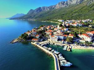 an aerial view of a small town on a body of water at Apartments Valentino in Gradac