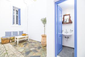 a bathroom with a sink and a toilet at The red door in Koskinou in Koskinou