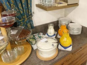 a kitchen counter with a blender and other items on it at Hotel Nès Crépes in Pozza di Fassa