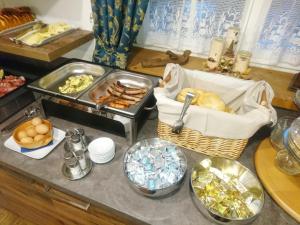 a counter top with a bunch of food on it at Hotel Nès Crépes in Pozza di Fassa