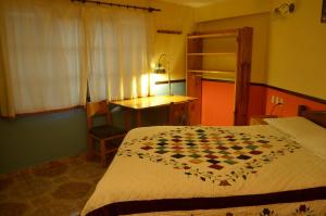 Postel nebo postele na pokoji v ubytování Hostal Pachamama