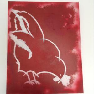 un dibujo de un pájaro sobre un fondo rojo en Le Bellevue, en Wimereux