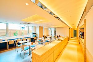 an office with tables and chairs and a cafeteria at Super Hotel Ogaki Ekimae in Ogaki