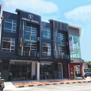 a black building with a v west hotel at Vrest Hotel in Malacca