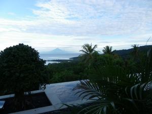 a view of the ocean from a house at The Puncak Lombok in Senggigi