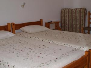 Postel nebo postele na pokoji v ubytování Batika Rooms