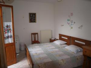 Postel nebo postele na pokoji v ubytování Batika Rooms