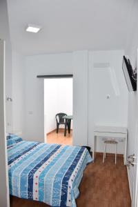 Posteľ alebo postele v izbe v ubytovaní Apartamento Quintana