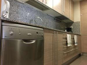 Kuchyň nebo kuchyňský kout v ubytování Apartment familiar