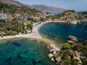 an aerial view of a beach with people in the water at Casa Martina in Giardini Naxos +22 photos