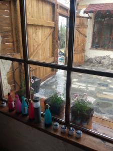 a window with vases sitting on a window sill at Lavash Hotels LLC in Sevan