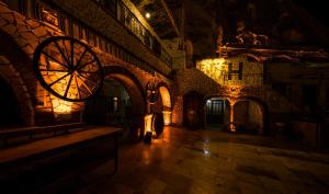 a dark room with a large clock on the wall at Elite Cave Suites in Göreme