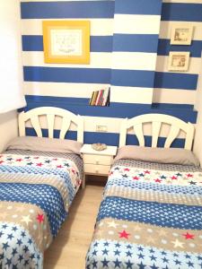Posteľ alebo postele v izbe v ubytovaní Apartamento Cristina 8