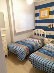 Posteľ alebo postele v izbe v ubytovaní Apartamento Cristina 8