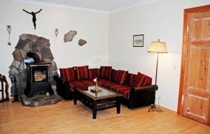 a living room with a couch and a fireplace at Ferienwohnungen im Gutshaus Gnies in Gnies +75 photos