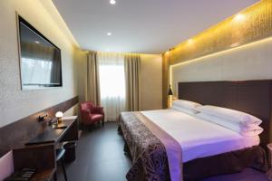 Ένα ή περισσότερα κρεβάτια σε δωμάτιο στο Felix Hotel