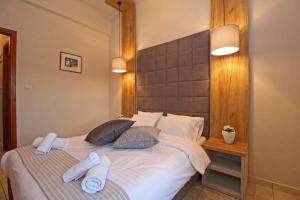 Ліжко або ліжка в номері Arion Hotel