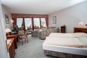 Postel nebo postele na pokoji v ubytování Hotel Sonnenhof