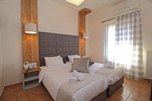 Ліжко або ліжка в номері Arion Hotel