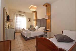 Ліжко або ліжка в номері Arion Hotel