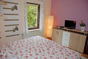 Ein Bett oder Betten in einem Zimmer der Unterkunft Ferienappartements Haus Fischersruh