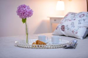 Posteľ alebo postele v izbe v ubytovaní Leona Apartments