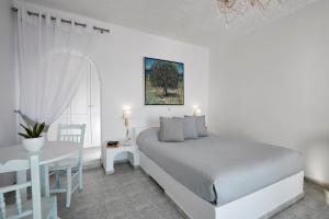 Letto o letti in una camera di Andromeda Villas & Spa Resort
