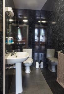 a bathroom with a sink and a toilet at Bannockburn Inn in Helmsdale